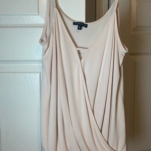 A very soft, baby pink tank top.